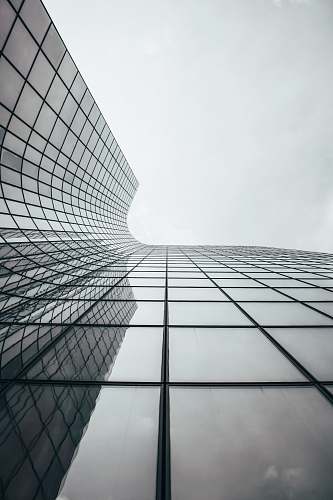 high rise clear glass walled high-rise building office building